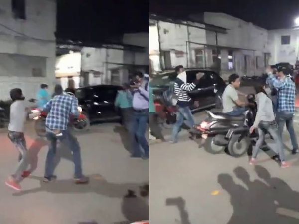 कानपुर में बीच सड़क युवक को पीटती युवती। - Dainik Bhaskar