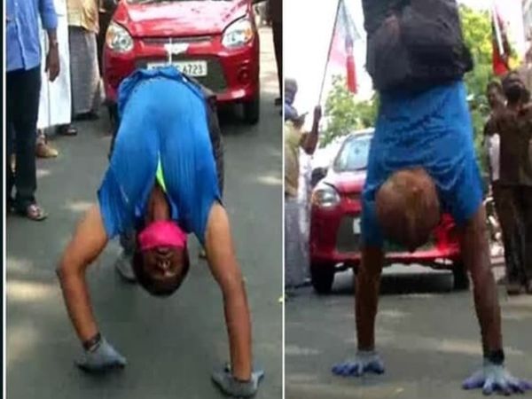 आरएसपुरम में AIADMK नेता के समर्थन में एक कार्यकर्ता ने सिर नीचे और पैर ऊपर कर कार खींचकर दिखाई।