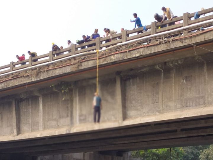 The body was found hanging under a bridge near Pardi in Valsad, crowds of people gathered