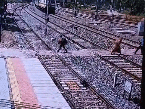RPF jawan rescues woman from approaching train at station Video shows ...