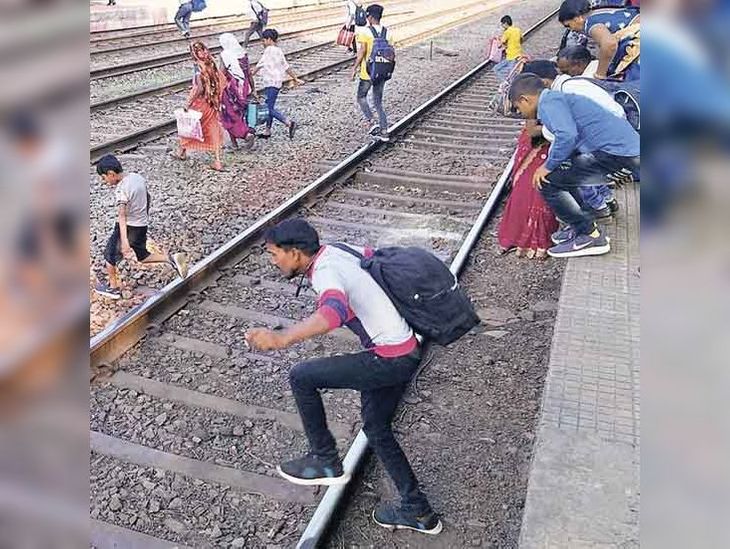 Coach display on platform number 2, passengers running on the track due ...
