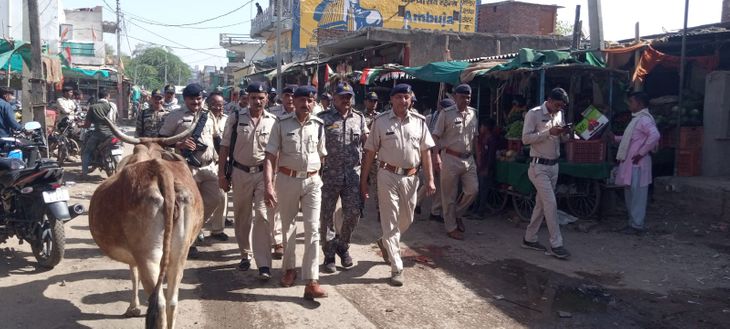 A flag march was taken out to maintain peace and code of conduct ...