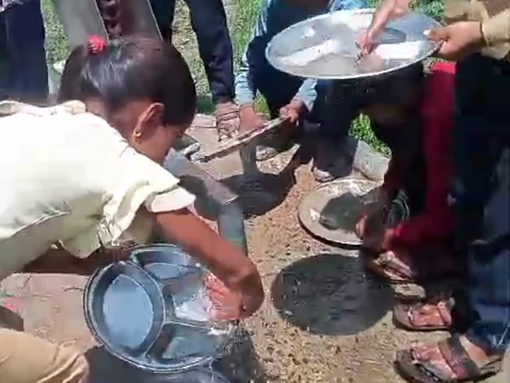 Giving roti and vegetables to students and making them wash utensils ...