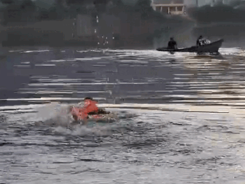 Two youths landed in the pond with a damaged boat