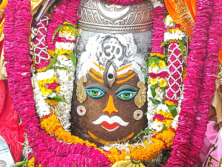 Baba Mahakal adorned in the form of a king wearing the trinetra ...