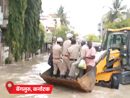 Image shows the aftermath of heavy monsoon rains in India.  Flooded homes and destruction highlight the severe impact of the weather.