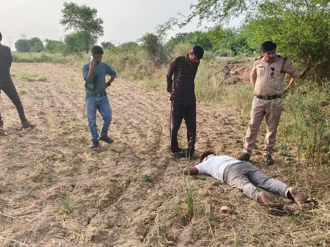 The body of a young man was found in a roadside ditch along with his ...