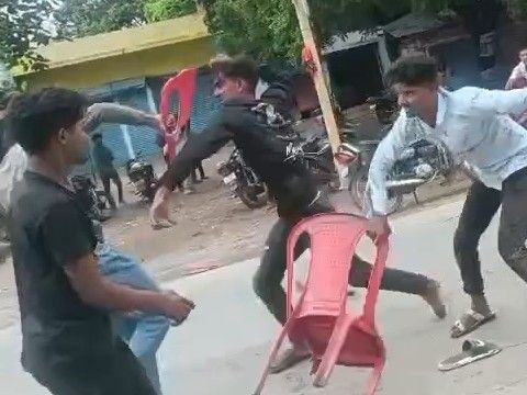 Two parties fight over sitting on a chair in a hotel