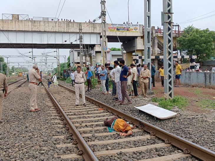 A woman died after being hit by a freight train while crossing the
