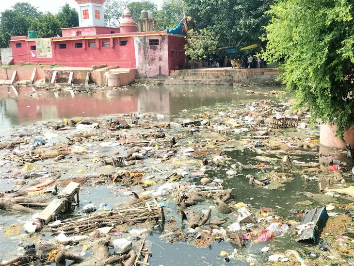Garbage spread in the historical Khaira temple pond of Gonda