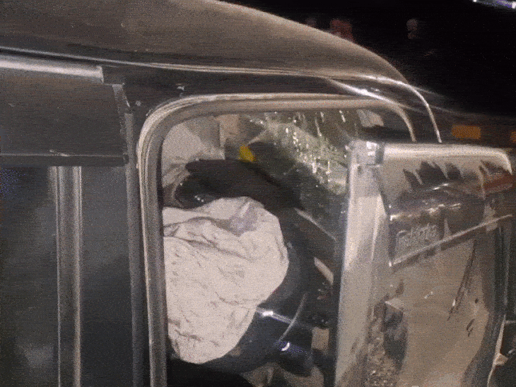 Bus gets stuck in highway railing after collision with Scorpio
