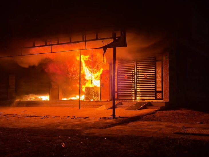 A short circuit caused a fire in a shop, burning goods.