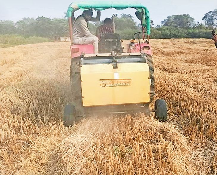 Somesh collects fodder using a baler machine, eliminating the need to ...