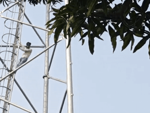 A young man climbed a tower to get his girlfriend.