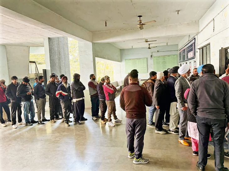 Long lines of people form outside the driving test track and RTO office ...