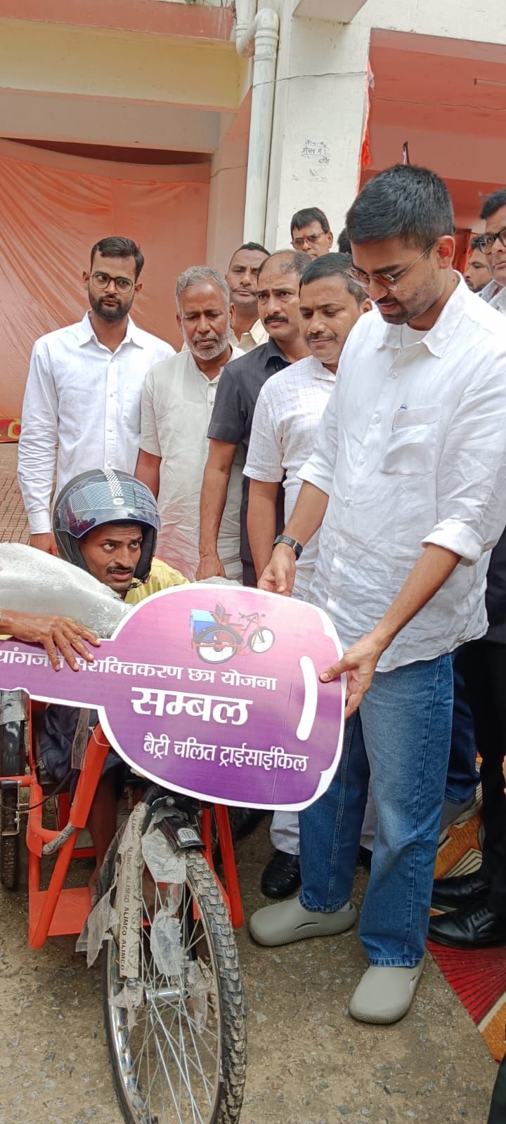 Two differently-abled people received battery-operated tricycles at the ...