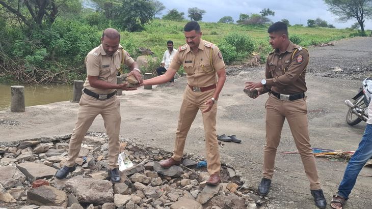 The pothole on the road washed away by the flood has been filled and ...