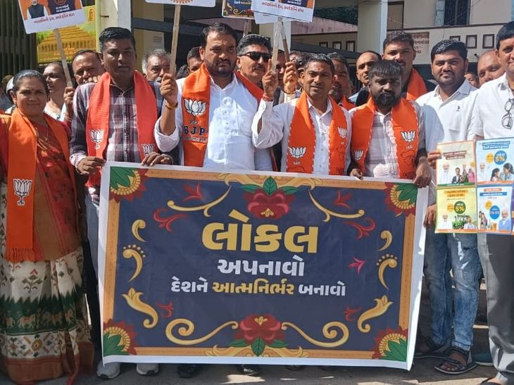 Stickers put up on shops at BJP rally, public awareness campaign on GST ...