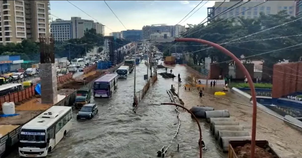 Bengaluru roads submerged after intense afternoon rainfall.