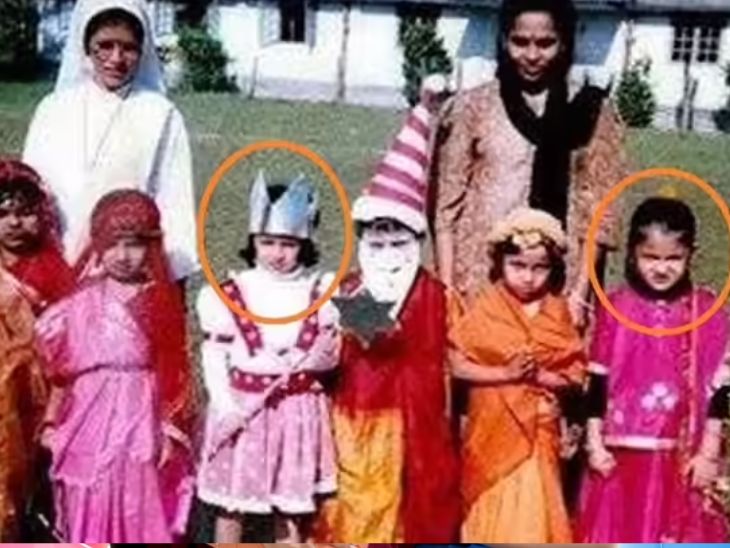 साक्षी धोनी गुलाबी फ्रॉक (बाएं, गोलाकार) में खड़ी हैं जबकि अनुष्का शर्मा दाईं ओर गुलाबी लहंगा पहने हुए हैं।