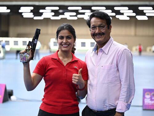 Manu Bhaker with her coach Jaspal Rana, during a competition.