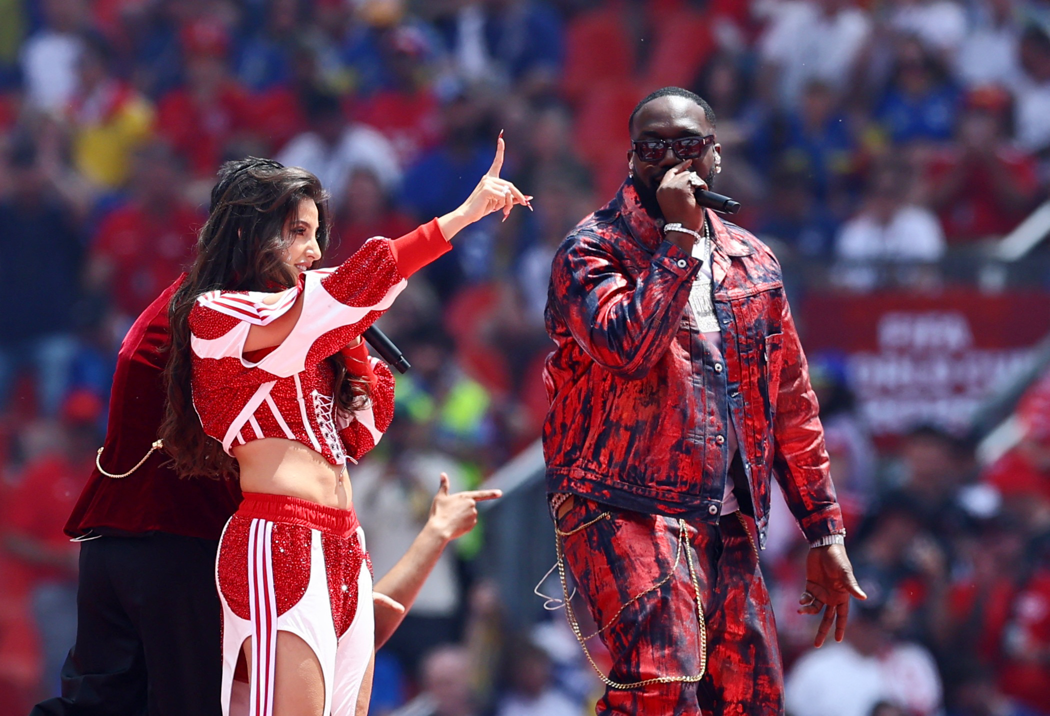 Singers Nora Fatehi, Vegedream and Sanjoy perform during the opening ceremony (Credits: Reuters)
