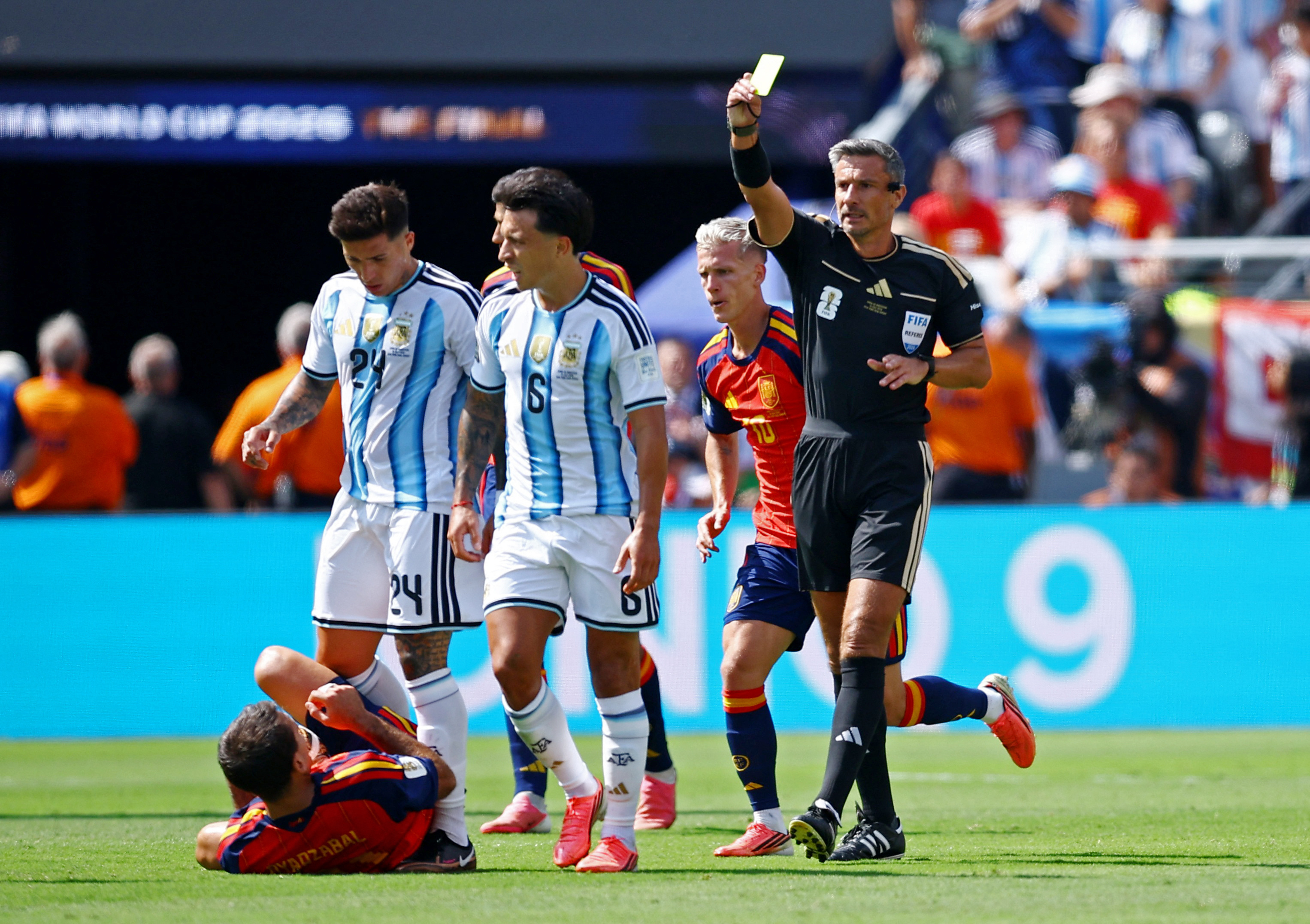 Referee shows yellow card to Lisandro Martinez (Credits: Reuters)