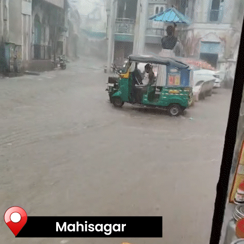 Two and three quarter inches of rain in Balasinor, river flowed through the market.