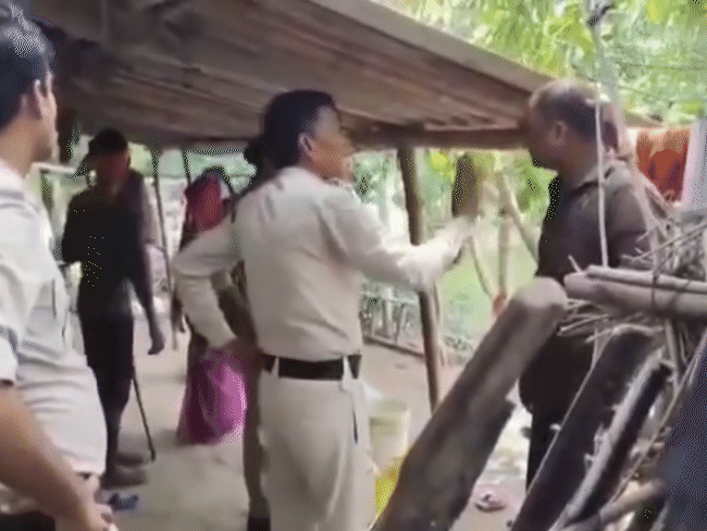 Members of the excise team trying to explain to the villagers. - Bhaskar English