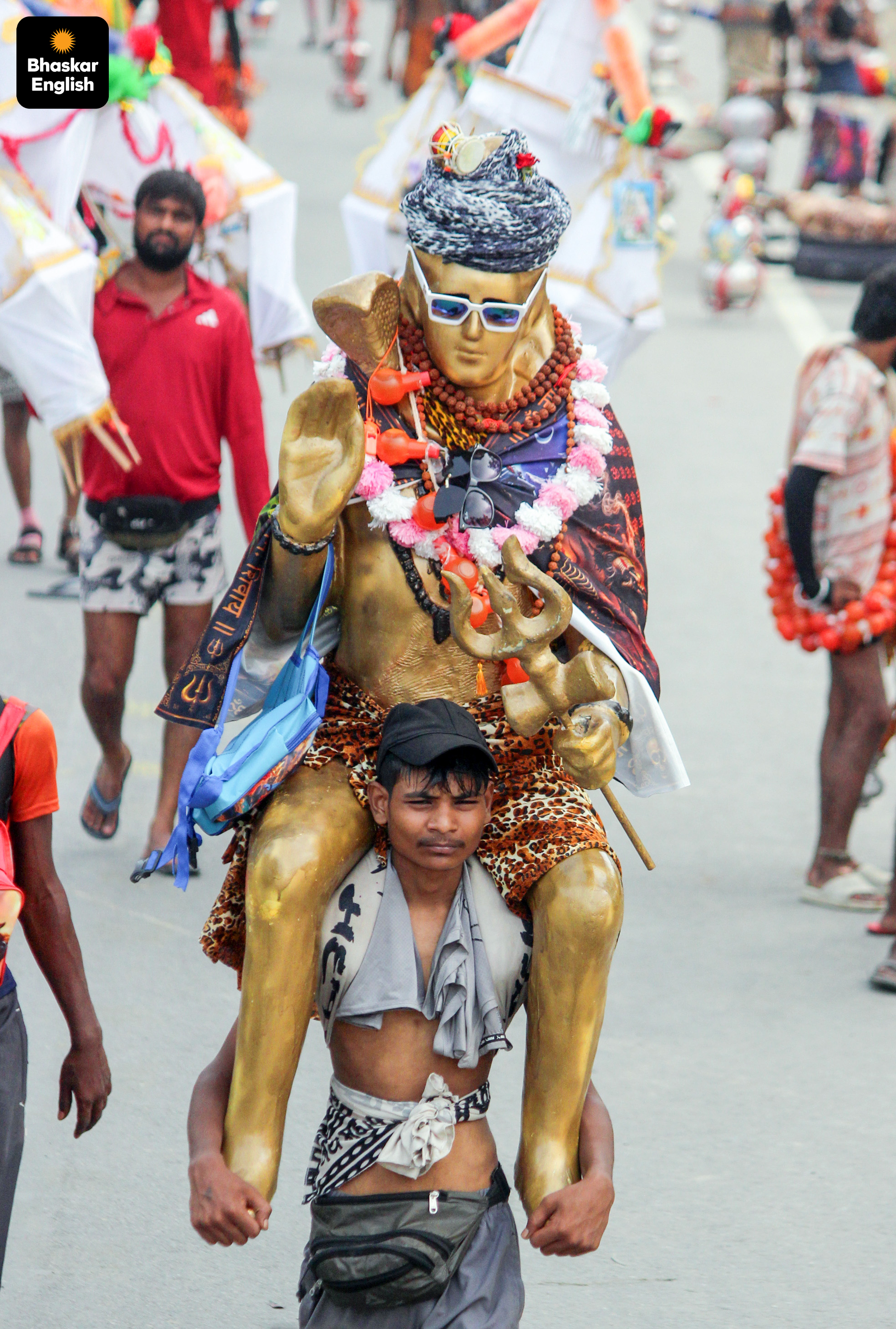 Faith on the move: A devotee carries an idol of Lord Shiva during the Kanwar Yatra in Meerut (PHOTO: ANI)