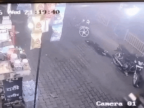 Bike-riding attackers fleeing after firing in Hisar and injured woman and her daughter receiving treatment at Jindal Hospital. - Bhaskar English