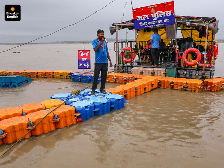 Water, Water Everywhere: A Jal Police post sits amid rising floodwaters as the Ganga overflows at Dashashwamedh Ghat in Prayagraj (Photo: PTI)