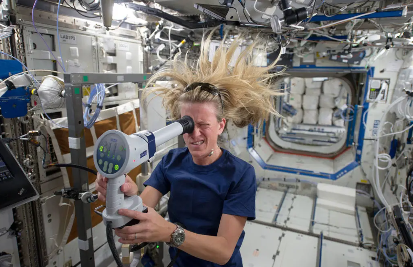 NASA astronaut Karen Nyberg uses a fundoscope in orbit to photograph her retina, helping scientists study how spaceflight affects the eyes. Image Credit: NASA