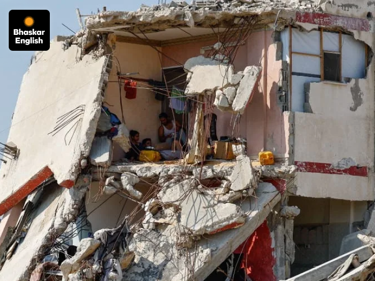 Struggle For Survival: Hundreds of buildings have been damaged by Israeli airstrikes in Gaza. A Palestinian family sits in one such damaged building.
