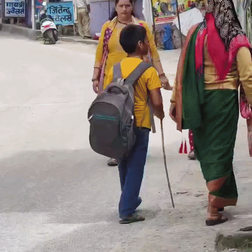 Due to the fear of dog attacks, people are carrying sticks in their hands for protection while stepping out of their houses
