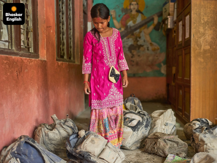 'Hope Amid the Mud': A schoolgirl searches for her bag after floods ravage her school in Nepal's Galchhi