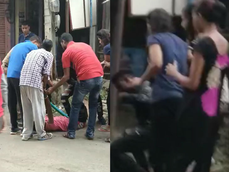 जमीन पर गिरने के बाद परिजन और लोग उसे उठाकर ले जाते हुए।