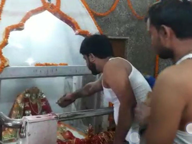 Devotees worshiping in the temple.