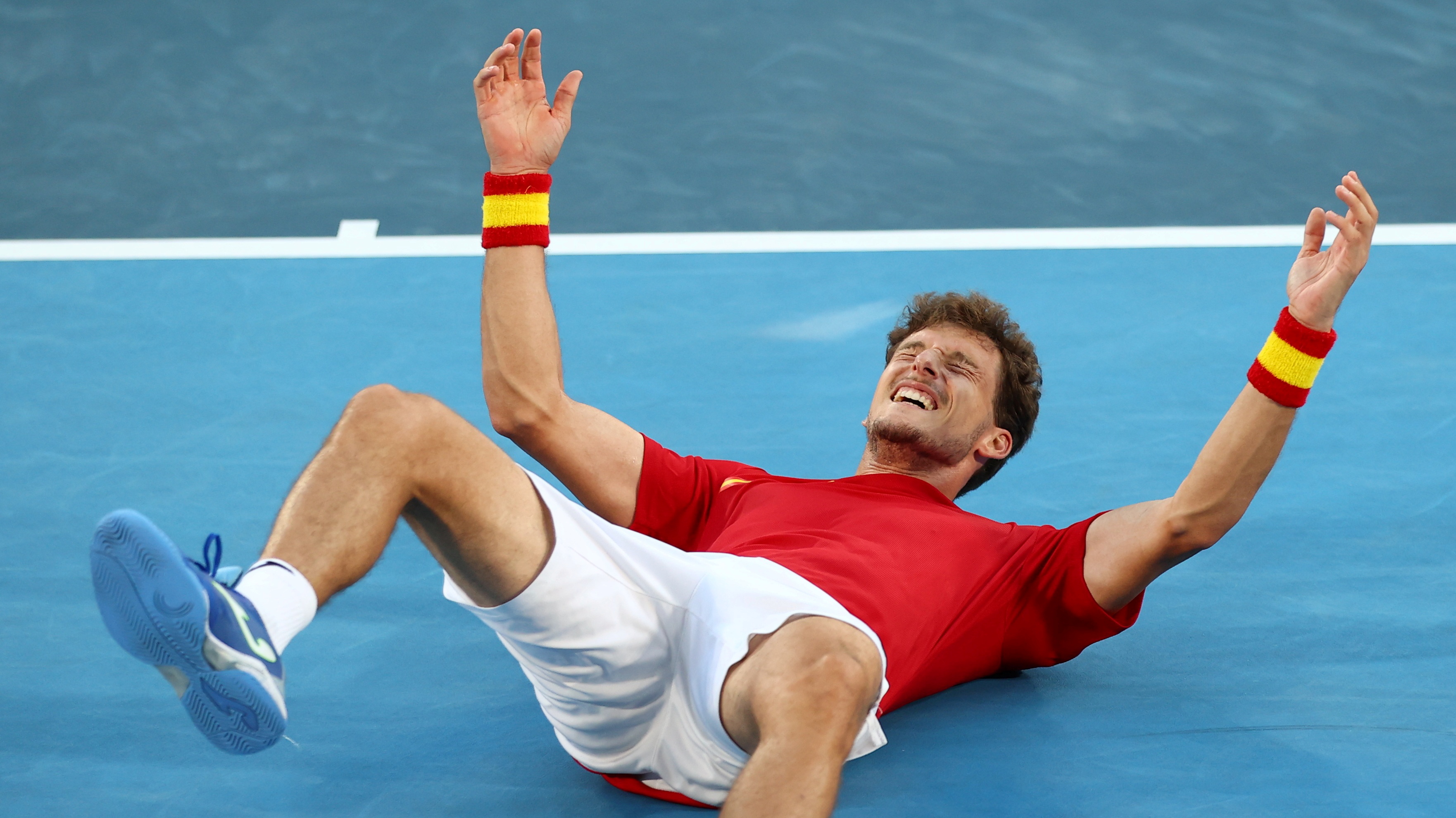 पाब्लो बुस्टा ने जोकोविच को ब्रॉन्ज मेडल के मैच में 6-4, 7-6, 6-3 से हराया। जीत के बाद वे खुशी से जमीन पर लेट गए।