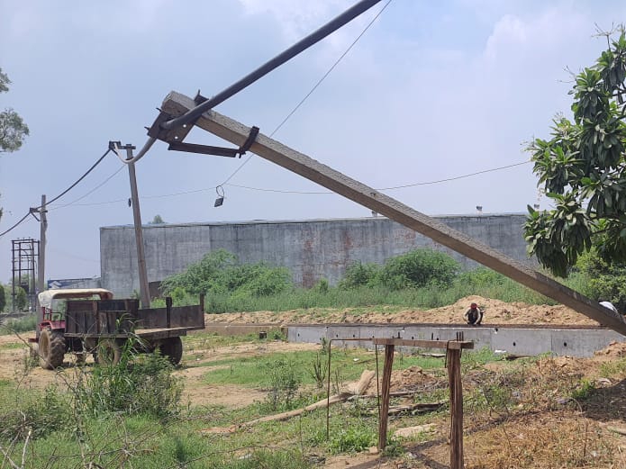 Three youths riding the electric pole, which was broken by a truck near ...