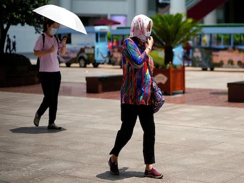 In China, the heat has made life difficult for the people.  The streets of Shanghai, the financial capital of China, look completely deserted.  Only a few people are going out for essential work.