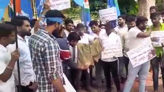 NSUI activists burn khaki colored half pants in Bengaluru in June 2022.