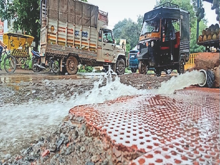 Choked drain due to soil sinking on the highway, water filled in more
