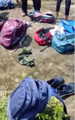 Children's bags and books were soaked by the water of the river.
