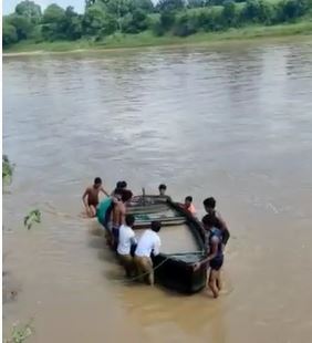 After some time the villagers took the boat out of the river.