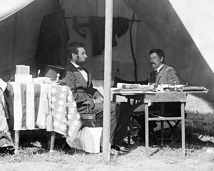 In this October 3, 1862 photo, President Abraham Lincoln is seen sitting in a tent with General George B. McClellan after the Battle of Antietam.