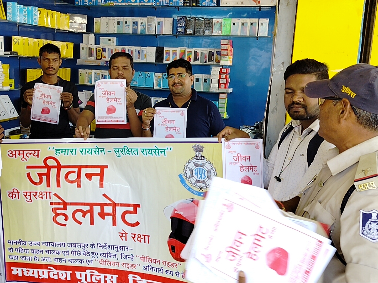 Distribute pamphlets related to following traffic rules and wearing