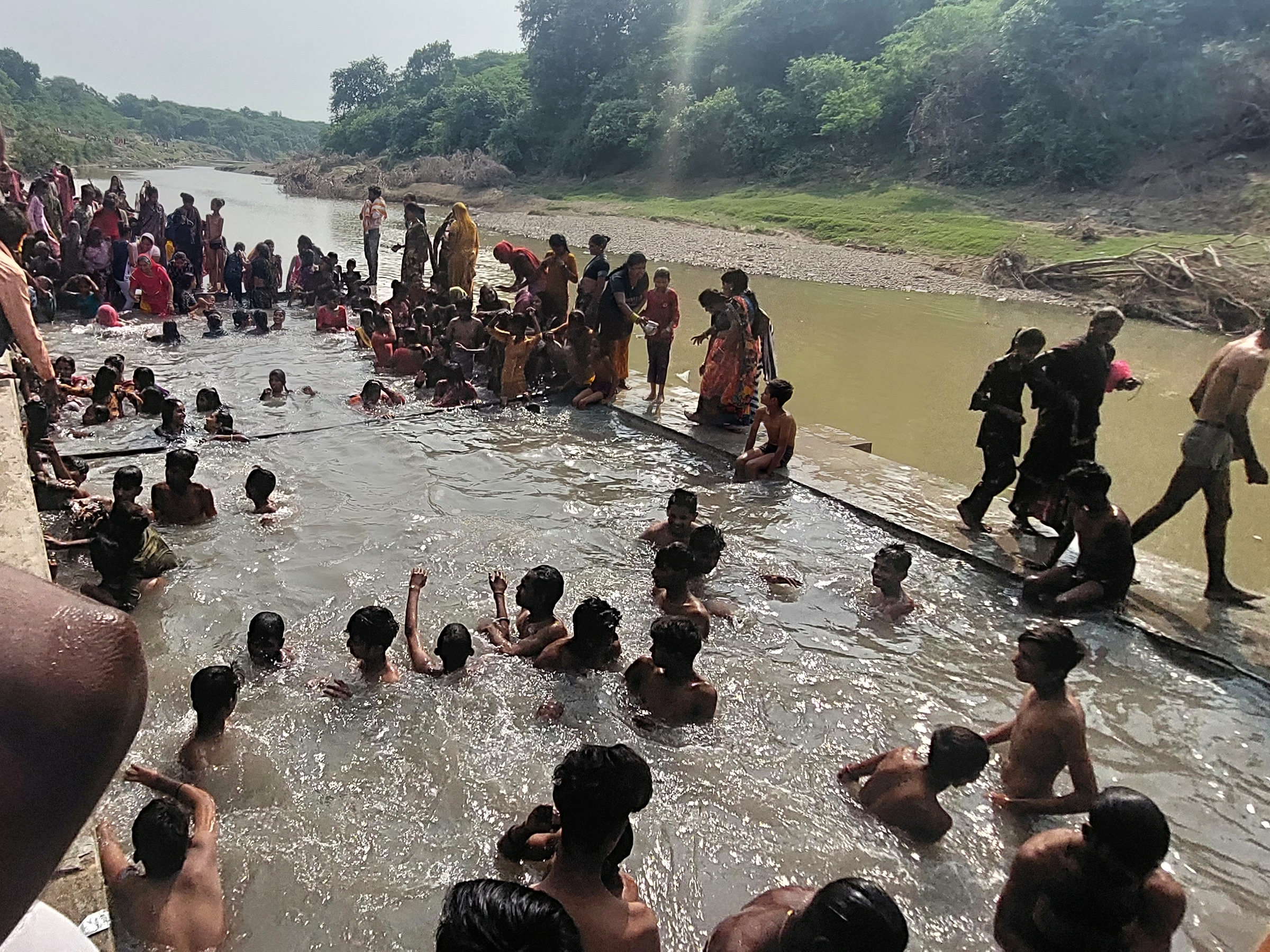 People gathered for a bath at the holy pool of Nagda, the main pool was ...