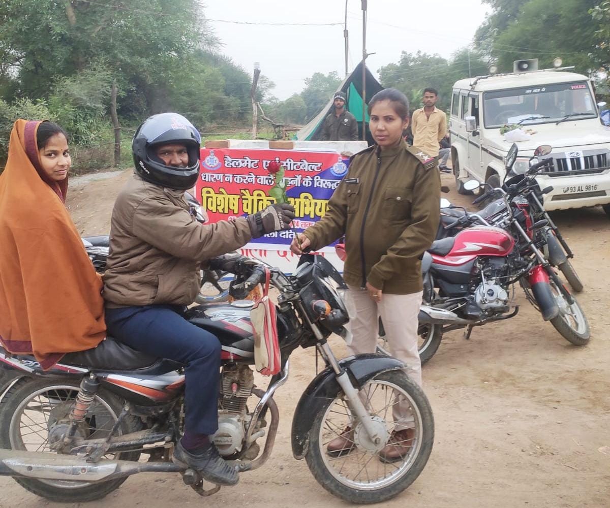Flowers given to those wearing helmets, challans issued to those