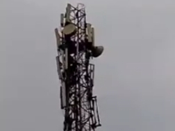 A young man climbed a tower over a land dispute | जमीन विवाद को लेकर ...